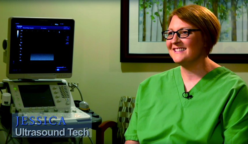 GRHS_EmployeeStories_1_FI A woman in a patient exam room. Text says Jessica Ultrasound Tech.
