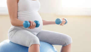 Pregnant woman exercising.