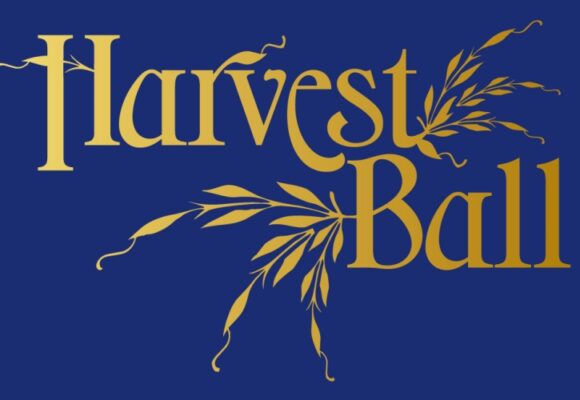 Blue background with gold lettering logo for Harvest Ball and wheat.
