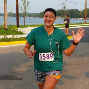 Woman running with a scrub top