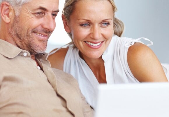 Couple looking at laptop