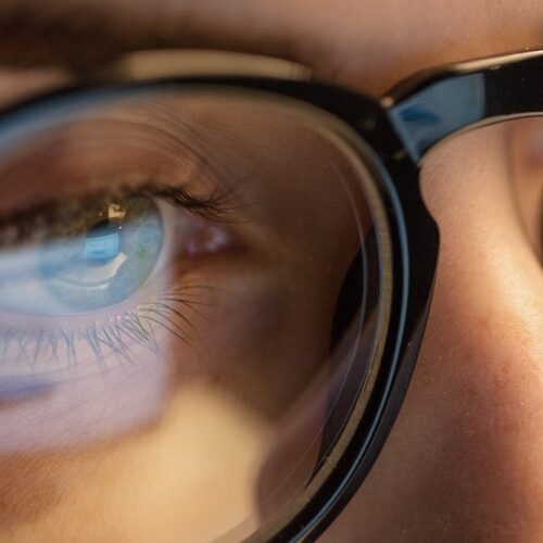 woman's eye through lens