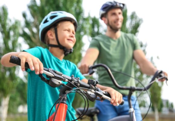 dad and boy on bikes outside