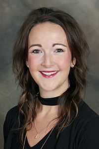 A professional headshot of a woman, Speech Therapist Brianna Hennen