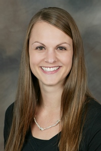 A professional headshot of a woman, Occupational Therapist Michelle Linz
