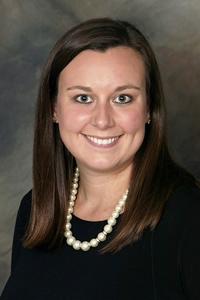 A professional headshot of a woman, Occupational Therapist Molly Maudal
