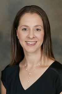 A professional headshot of a woman, Occupational Therapist Stephanie Sabol