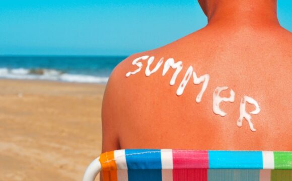 boy on beach with sunscreen