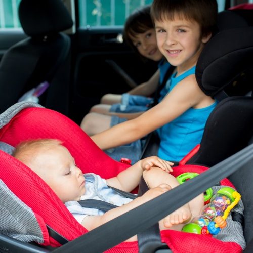baby and boys in car seats