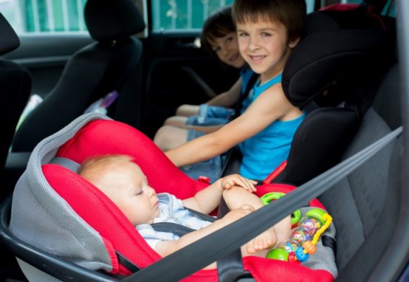 baby and boys in car seats