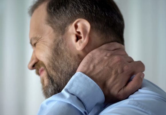 man and neck pain