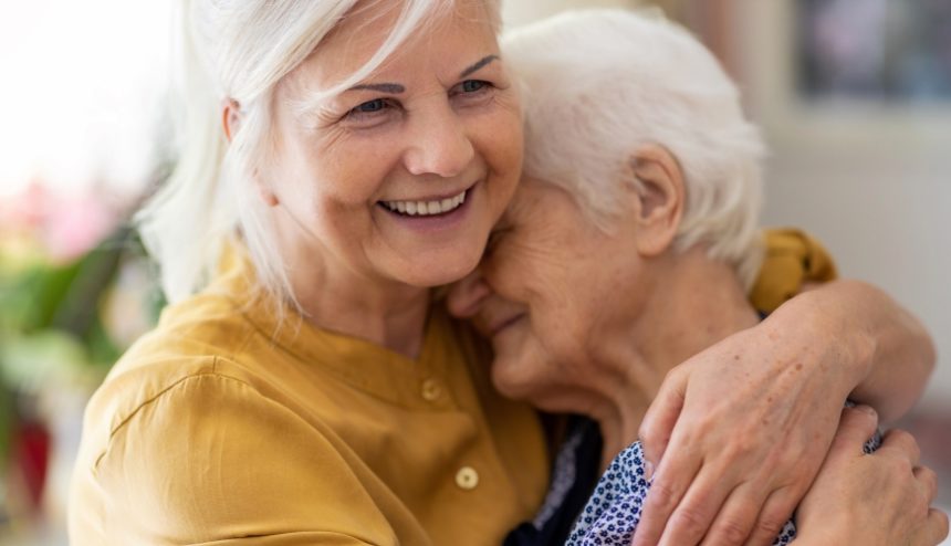 woman hugging an elderly woman