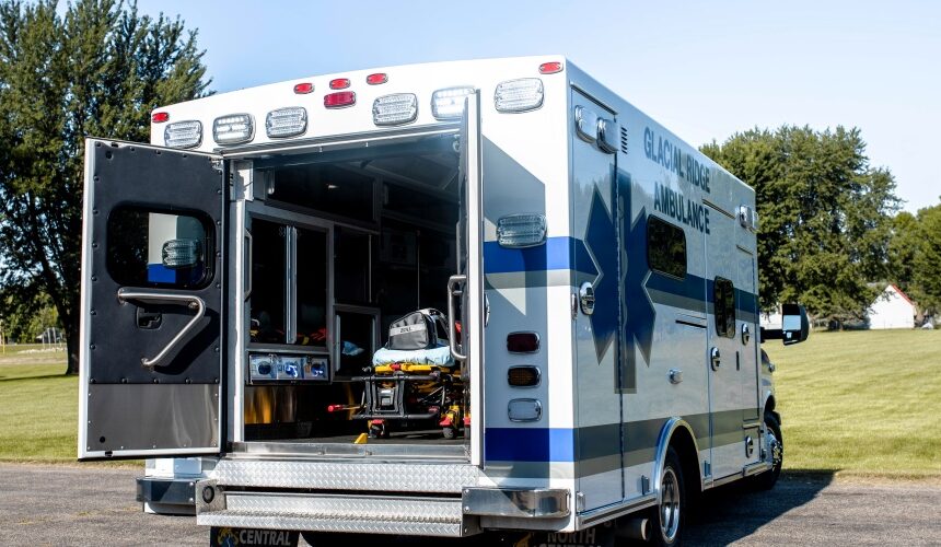 ambulance parked outside with back doors open ambulance parked outside with back doors open