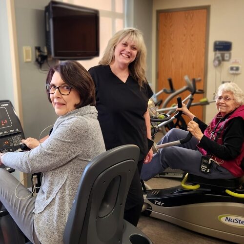 Three women at cardiac rehab gym