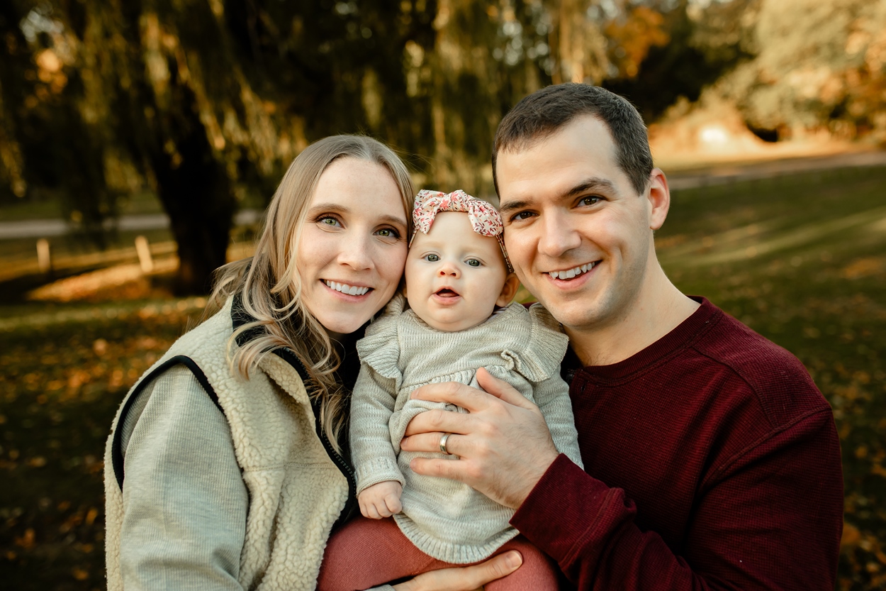 Family photo of young mom dad and baby