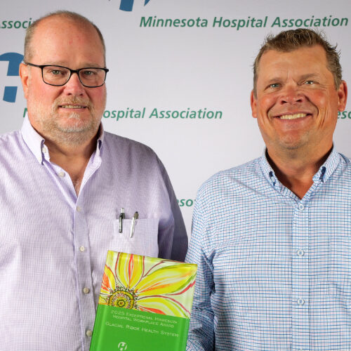 GRHS MHA Workplace Award 2025 Kyle and Kirk 2 men and an award