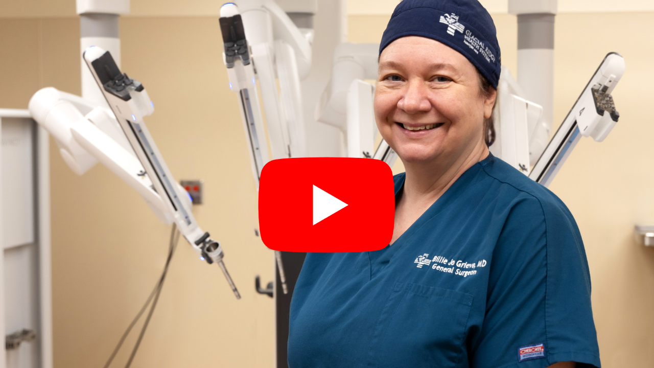 Dr. Grieve standing with da Vinci® Xi robotic-assisted surgery system she uses at Glacial Ridge Hospital in Glenwood, MN.