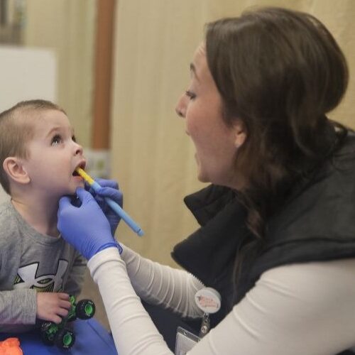 Brianna Hennen speech therapy oral stimulation with child