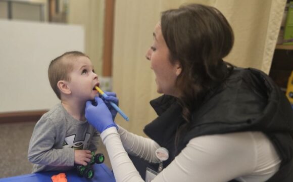 Brianna Hennen speech therapy oral stimulation with child