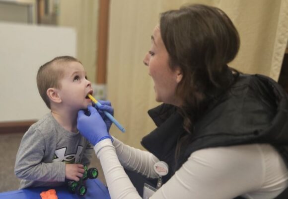Brianna Hennen speech therapy oral stimulation with child