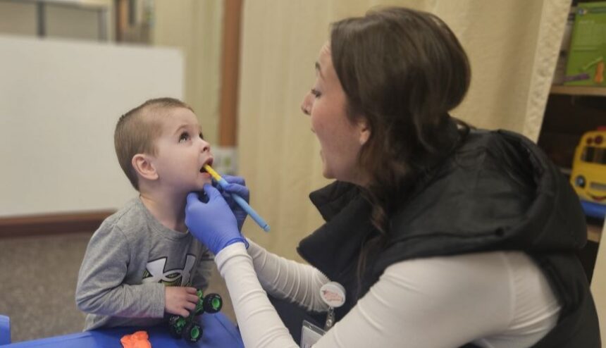 Brianna Hennen speech therapy oral stimulation with child
