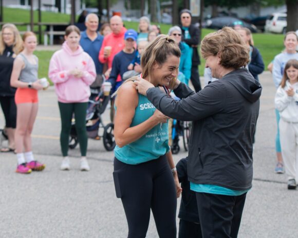 Group gathers to watch award ceremony at Scrub Run 5k race