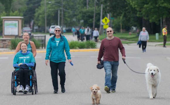 Group walking together with dogs at Scrub Run 5k