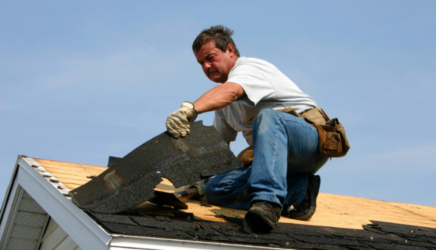 Man working on roof Man working on roof