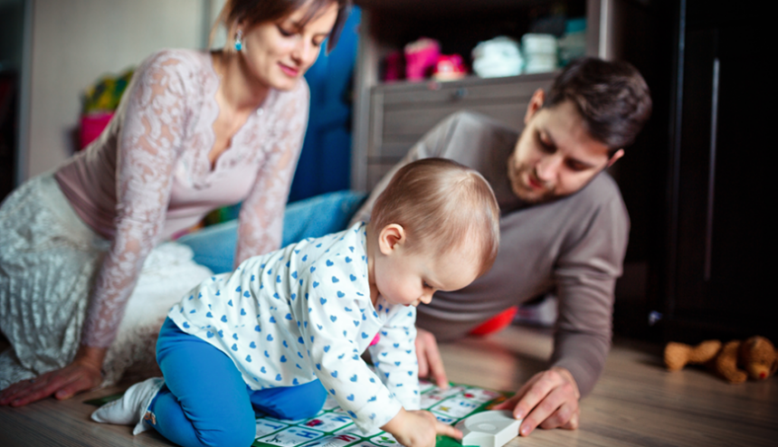Young parents playing with their child Family with young child