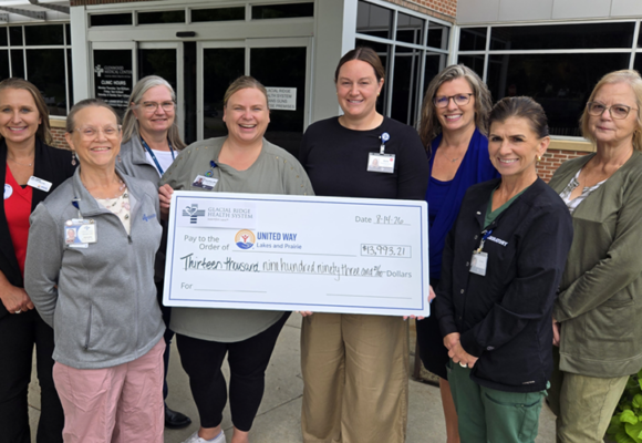 Employees Donate United Way 2026 women and a check