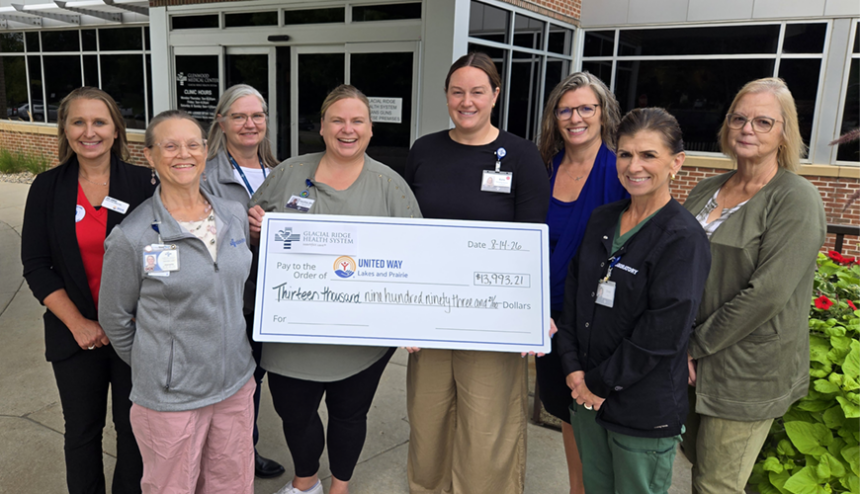 Employees Donate United Way 2026 women and a check