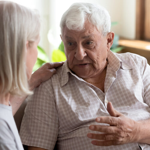 Older man talking to someone who cares Older man talking to a woman