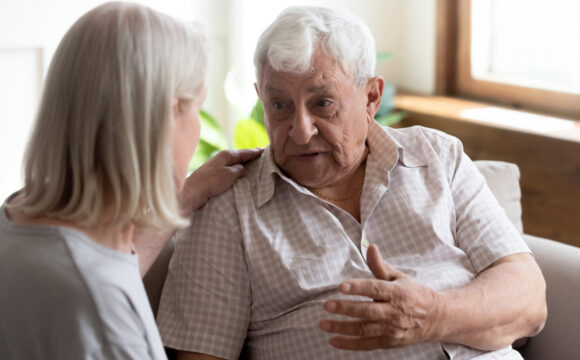 Older man talking to someone who cares Older man talking to a woman