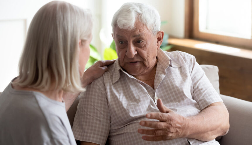 Older man talking to someone who cares Older man talking to a woman