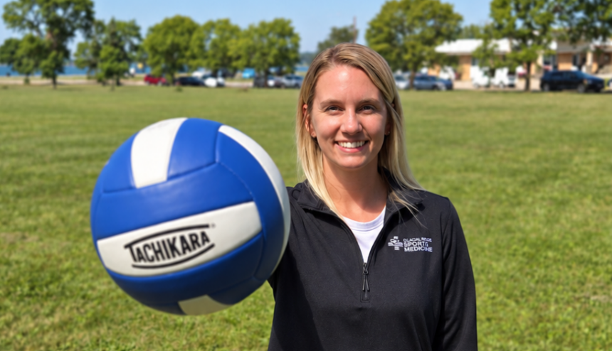 woman palming volleyball woman holding volleyball